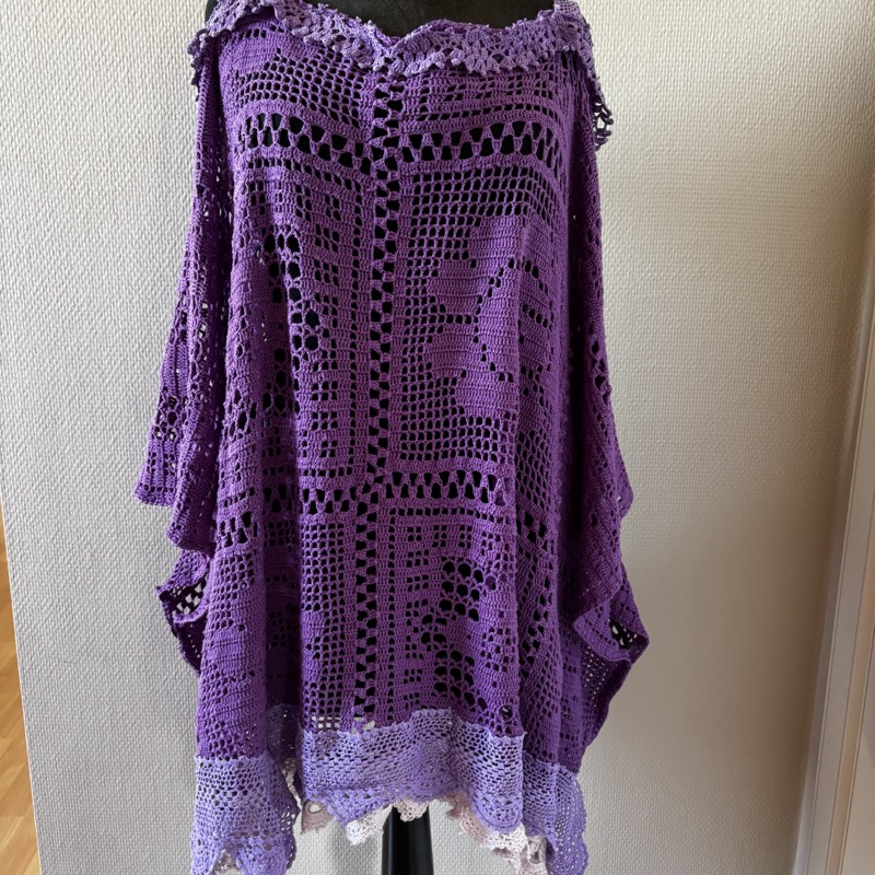 Purple crochet tunic on mannequin